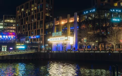 The Anthem music venue illuminated at night along the waterfront at The Wharf in Washington, DC.
